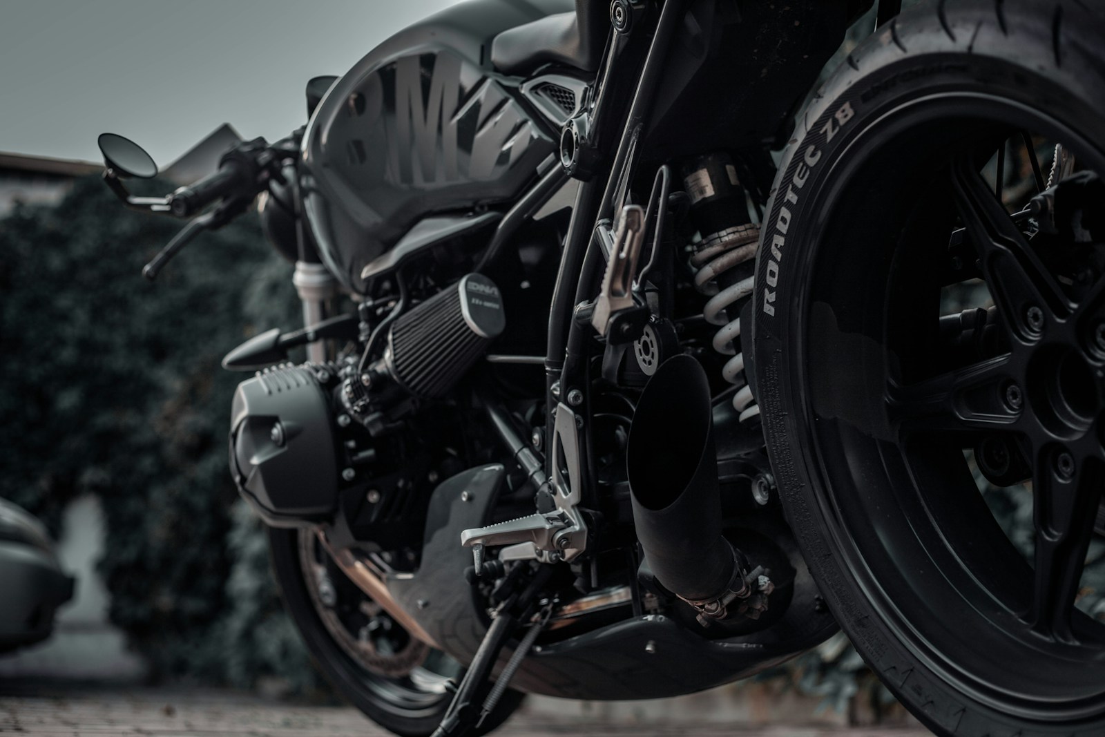black motorcycle on brown soil during daytime